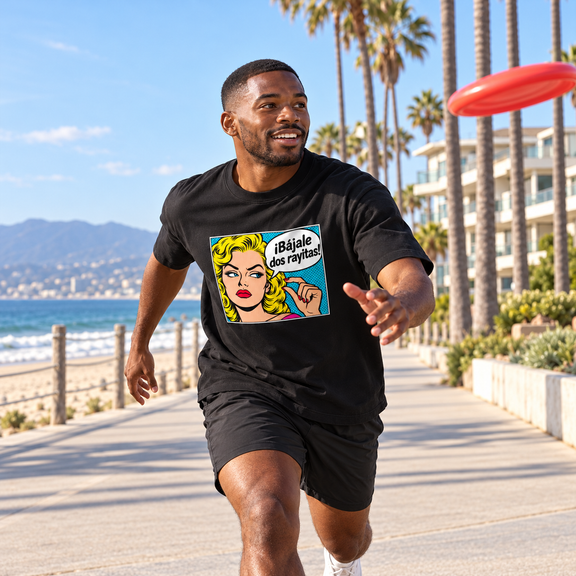 Model chasing a frisbee on the Santa Monica coast in the black Bájale Dos Rayitas Heavyweight Tee [Color: Classic Black]