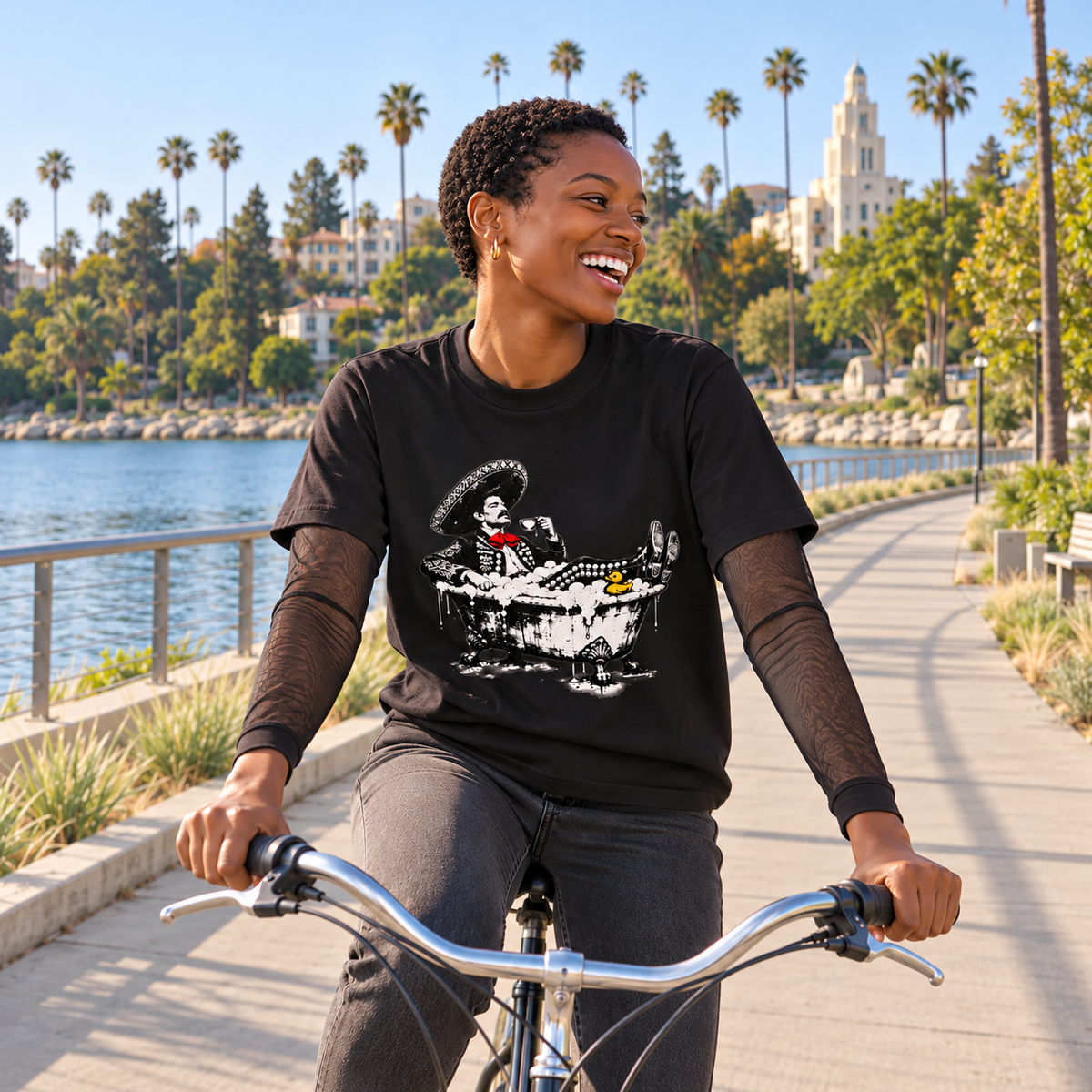 Model cycling by the Silver Lake Reservoir in the Bubble Bath Charro Layered Tee in black [Color: Black]