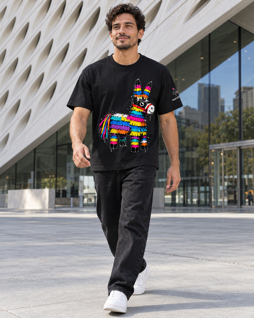 Nacoture model wearing Piñata Cotton Tee [Color: Black] [Model: Men]