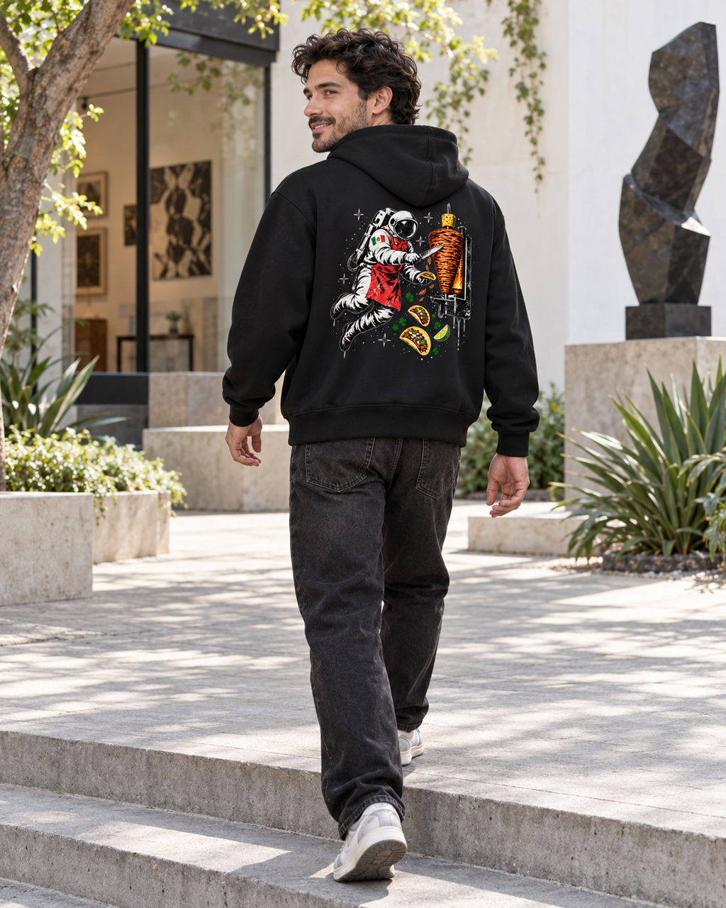 Nacoture model wearing Space Taquero Full-zip Hoodie [Color: Black] [Model: Men]