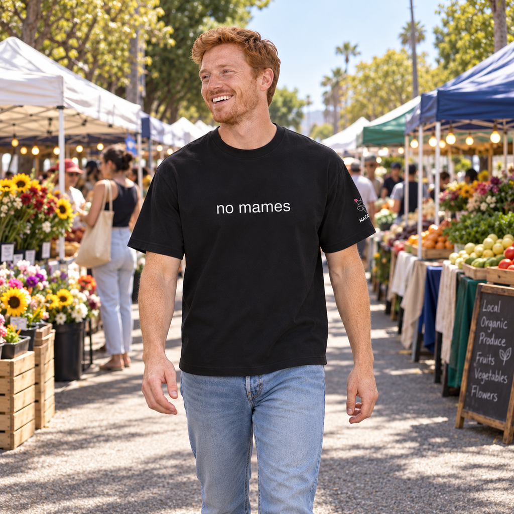 Model wearing Streetwear Loose Drop Shoulder T-Shirt in a natural everyday scene [Color: Black Beauty]