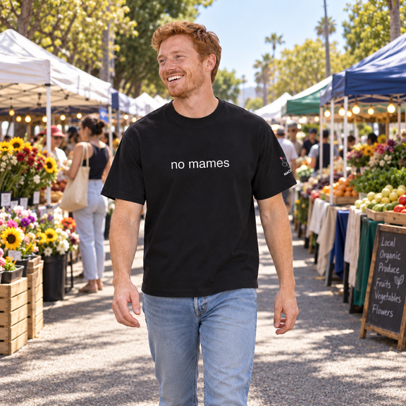 Model wearing Streetwear Loose Drop Shoulder T-Shirt in a natural everyday scene [Color: Black Beauty]