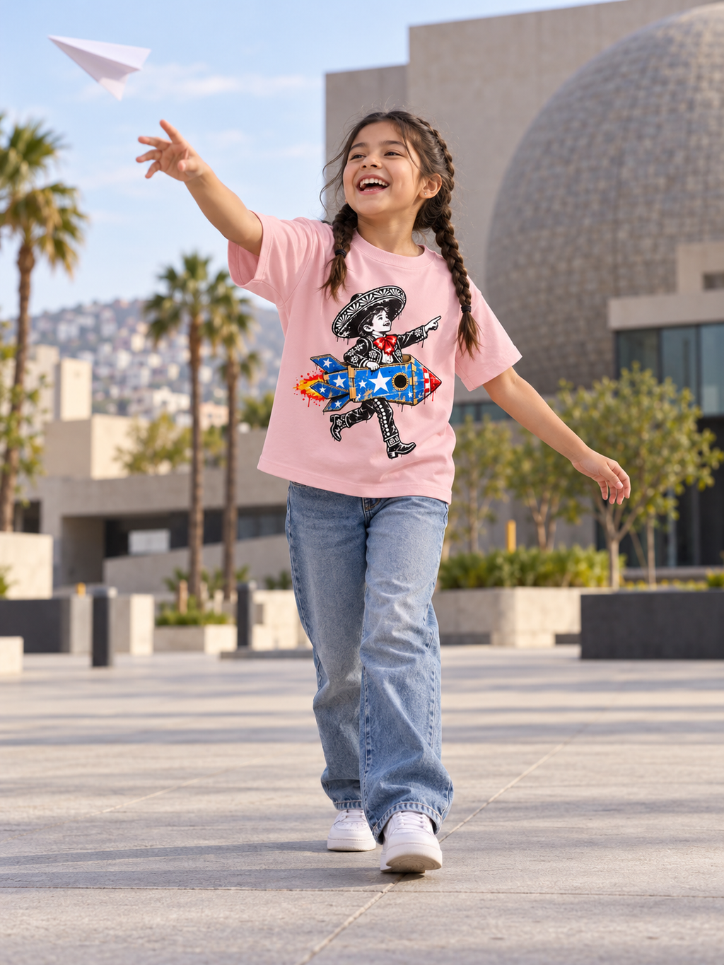 Child wearing Charrito rocket tee [Color: Pink]